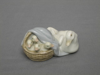 A Lladro figure of a female Goose and goslings in basket 3"