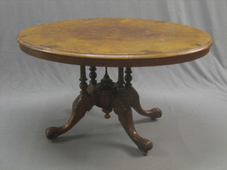 A Victorian oval walnut Loo table, raised on a turned column base 47"