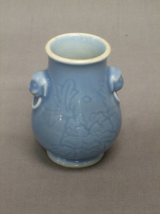 An Oriental blue glazed twin handled club shaped vase with lion mask and ring handles, the base with 4 character mark 3 1/2"