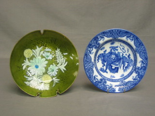 A Royal Doulton blue soup bowl decorated mythical beasts 8" together with a green enamelled dish with floral decoration 8"