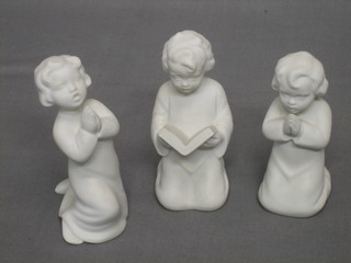 3 white glazed biscuit porcelain figures of children in prayer, incised BA 4"