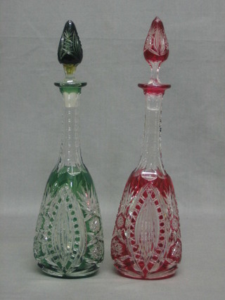 A pair of Bohemian cut glass club shaped liqueur decanters and stoppers (chip to stopper) 12"