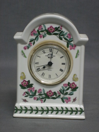 A Quartz operated mantel clock contained in an arch shaped Port Meirion case