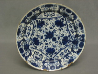 An 18th Century Delft blue and white plate with floral decoration 12" (some chips and cracked)