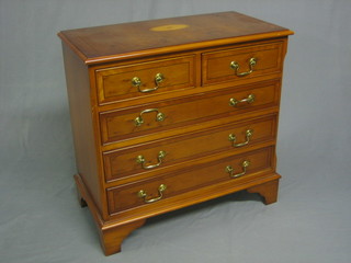 A Georgian style inlaid yew chest of 2 short and 3 long drawers with brass swan neck drop handles, raised on bracket feet 29"