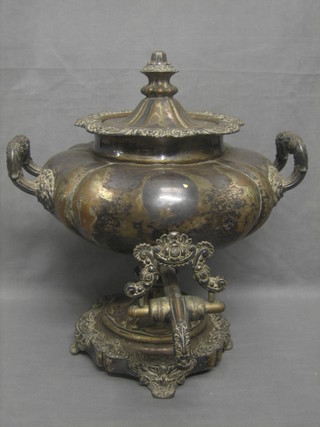 A 19th Century silver plated twin handled tea urn with cast body raised on a circular spreading foot 15"