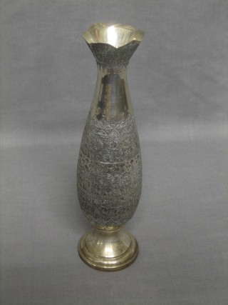 An Eastern silver club shaped vase with engraved decoration raised on a spreading foot 10"