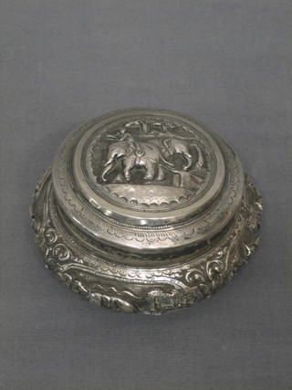 A circular embossed Eastern silver bowl and cover 4 ozs