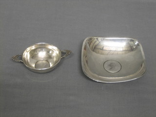 A circular Eastern silver twin handled dish and an Eastern silver ashtray set a coin 3 ozs