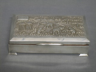 An Eastern silver cigarette box with embossed lid decorated elephants in a plantation 6 1/2"