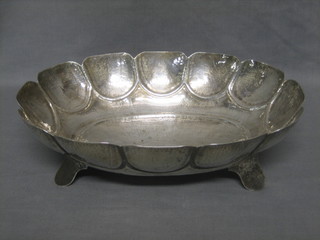 An Eastern planished silver oval dish raised on 4 panel feet 16 ozs