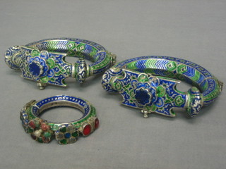 A pair of Persian style white metal and enamelled arm/ankle bracelets and 1 other