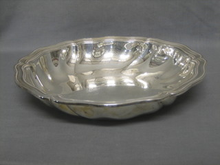 A Continental silver circular dish with panelled border, marked 800 WTB, 20 ozs