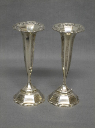 A pair of octagonal silver waisted specimen vases raised on octagonal feet, Birmingham 1911 5"