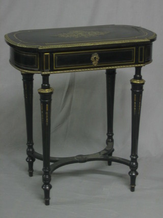 A 19th Century ebonised oval and inlaid brass dressing/writing table with hinged lid, raised on turned and fluted supports 26"