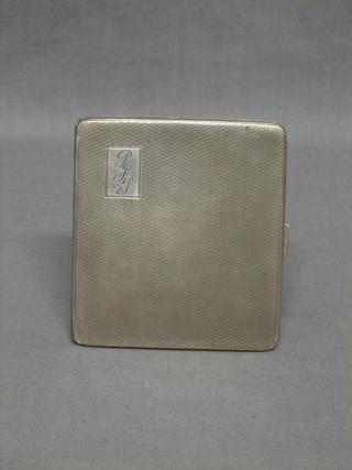 A silver cigarette case with engine turned decoration Birmingham 1934 4 ozs