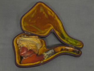 A 19th Century carved Meerschaum pipe, the bowl in the form of a bonnetted lady (r), cased