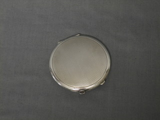 A circular silver compact with engine turned decoration Birmingham 1937