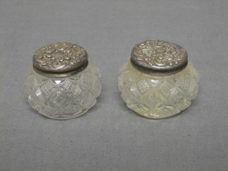 2 circular cut glass rouge pots with embossed silver lids 1"