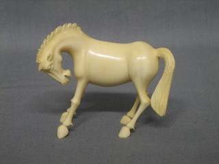 A carved ivory figure of a horse 2"