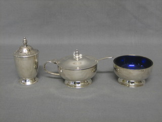 A 3 piece circular silver plated cruet set with mustard pot, salt and pepper by Garrard
