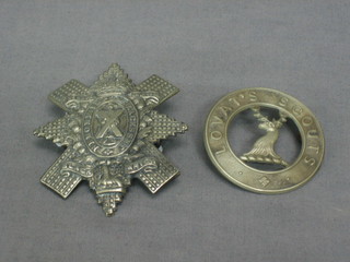 A Black Watch cap bage and a Lovat's Scouts cap badge (2)