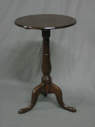 A 19th Century circular mahogany wine table, raised on pillar and tripod supports 18"