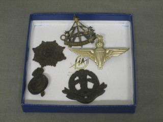 A Reconnaissance Corps cap badge, a Parachute Regt. cap badge, a plastic Middlesex Regt. cap badge, do. Army Service Corps and Army Catering Corps