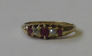 A Victorian 18ct gold dress ring set 2 diamond supported by sapphires