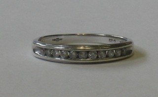 A 9ct white gold half eternity ring set diamonds