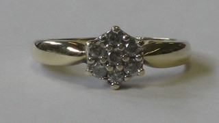 A 9ct gold cluster ring set diamonds