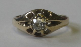 A 9ct gold Gypsy ring set a diamond