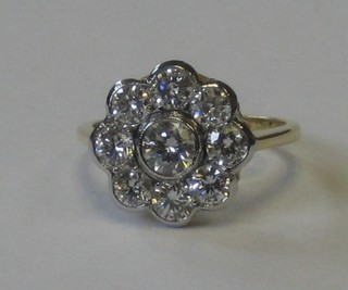 An 18ct yellow gold cluster dress ring set 9 diamonds approx 1.50ct
