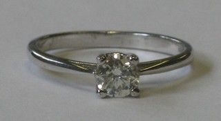 An 18ct white gold dress ring set a solitaire diamond approx 0.47ct