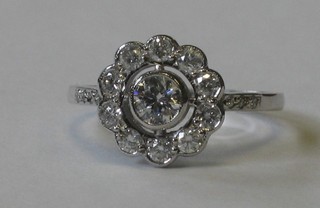 An 18ct yellow gold Art Deco style cluster dress ring set numerous diamonds and diamonds to the shoulders approx 0.75ct