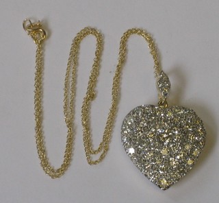 An 18ct gold heart shaped pendant set numerous diamonds approx 3.5ct