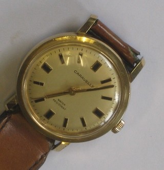 A gentleman's Caravelle wristwatch contained in a gold case