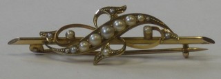 A 15ct gold bar brooch set demi-pearls