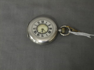 A Continental demi-hunter pocket watch contained in a silver case by The Manchester Watch Company, marked Triano 