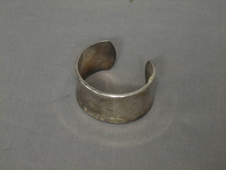 A silver Tiffany & Co. bangle marked 925 T & C 2001