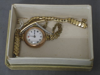 A lady's wristwatch contained in a gold case with enamelled dial and Roman numerals and an watch strap (f)
