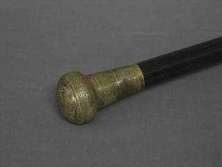 An ebony walking cane with silver knob