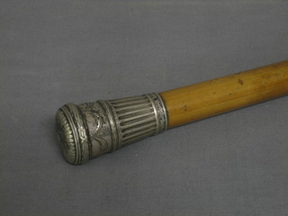 A Melacca cane with silver fluted knob with swag decoration