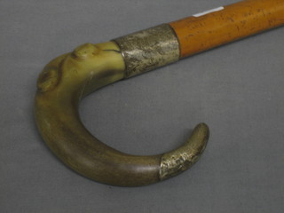 A Melacca walking stick with silver band and horn handle