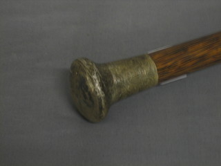 A hardwood walking cane with silver knob