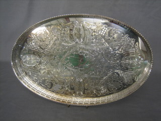 An oval engraved silver plated tray with pierced gallery 18"