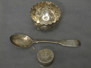 A Continental circular embossed silver salt, a circular jar and cover and a sifter spoon