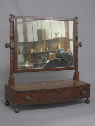 A 19th Century rectangular plate dressing table mirror raised on a mahogany stand with bow front base fitted 1 long and 2 short drawers 21"