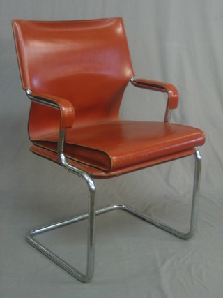 A 1960's chromium plated open arm desk chair with leather upholstery 