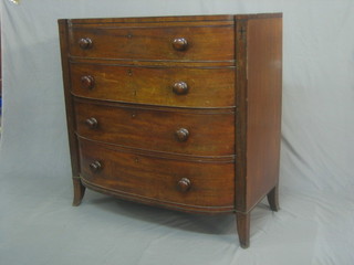A 19th Century mahogany bow front chest of 4 long drawers with tore handles, raised on splayed bracket feet 39"